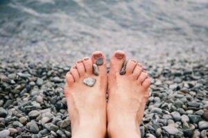 stones-on-woman-s-feet